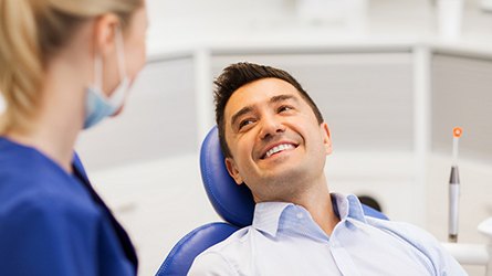 Man smiling at a dentist